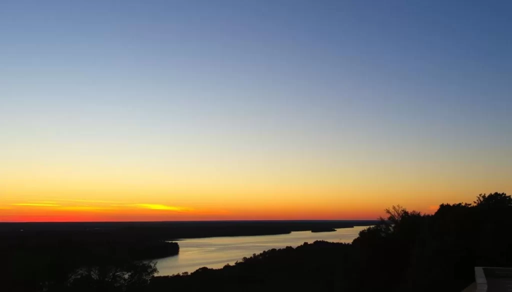 Image of Natchez Bluffs with a stunning sunset over the Mississippi River
