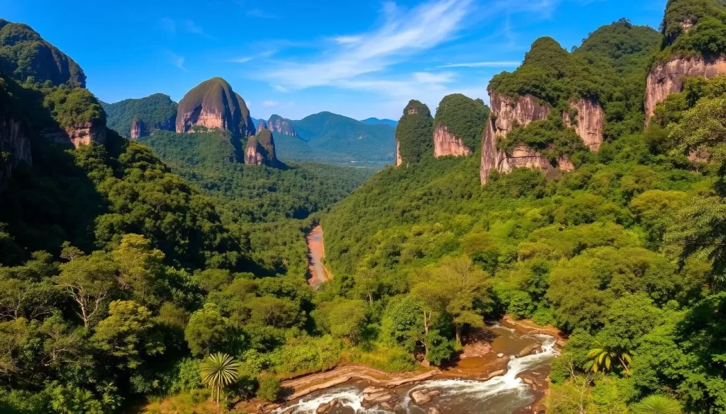 A breathtaking panorama of Gunung Mulu National Park in Malaysia, where lush rainforests, towering limestone cliffs, and winding rivers converge to create a natural wonder. In the foreground, a tranquil stream meanders through the verdant undergrowth, its crystal-clear waters reflecting the vibrant greens and browns of the surrounding landscape. In the middle ground, majestic limestone pinnacles rise up towards the azure sky, their jagged peaks casting dramatic shadows across the forest floor. In the background, dense rainforest canopies stretch as far as the eye can see, their vibrant hues creating a lush, inviting atmosphere. The scene is bathed in warm, natural light, casting a golden glow over the entire landscape and conveying a sense of peaceful serenity.