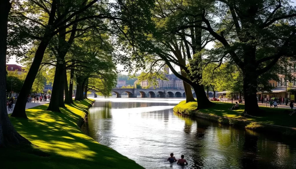 A tranquil scene along the Traun River in Wels, Austria. In the foreground, people leisurely stroll, cycle, and enjoy picnics on the lush riverbanks. Towering trees line the middle ground, their leaves casting dappled shadows over the water. In the distance, historic buildings and landmarks dot the riverfront, bathed in the warm glow of a golden afternoon sun. The river itself flows calmly, its surface reflecting the serene surroundings like a mirror. A picturesque and inviting atmosphere, perfect for outdoor adventures and leisure activities.