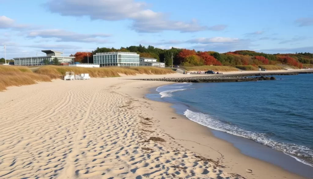 Generate an image of Port Crescent State Park Beach's sandy shoreline with modern facilities in the background.