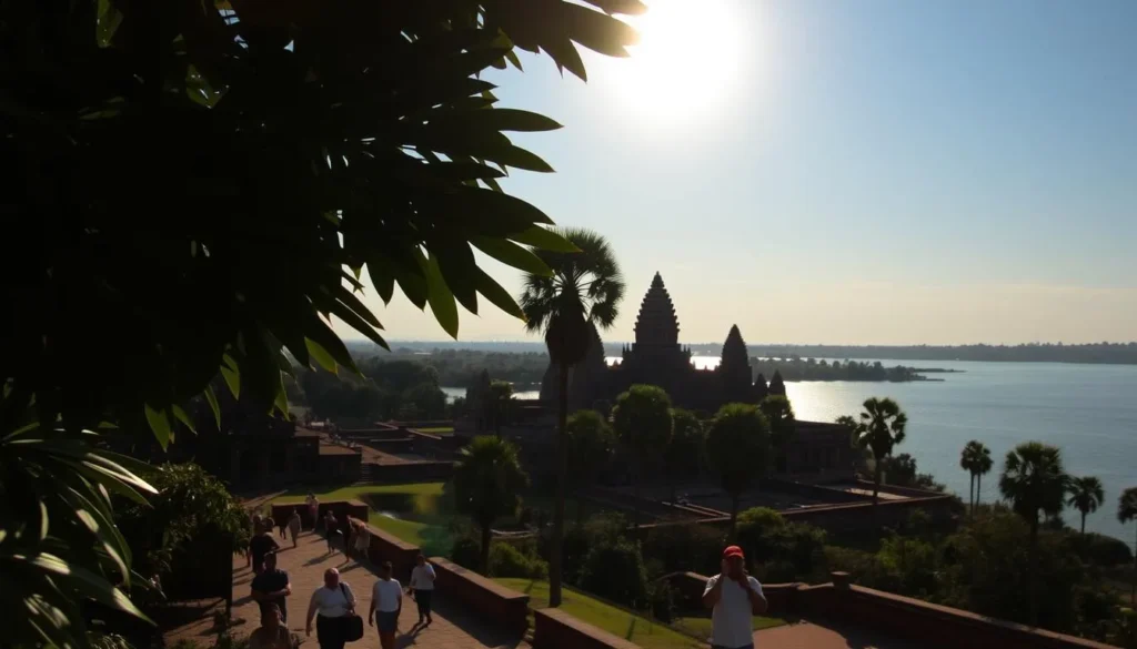 A tranquil scene in Siem Reap, Cambodia, under a warm, golden sun. In the foreground, lush tropical foliage frames a picturesque temple complex, its ancient sandstone walls aglow with a soft, amber light. In the middle ground, visitors wander the serene pathways, capturing the beauty of the moment with their cameras. The background features a glistening lake, its calm waters reflecting the azure sky above. The overall atmosphere is one of peaceful contemplation, inviting the viewer to experience the timeless allure of this historic destination.