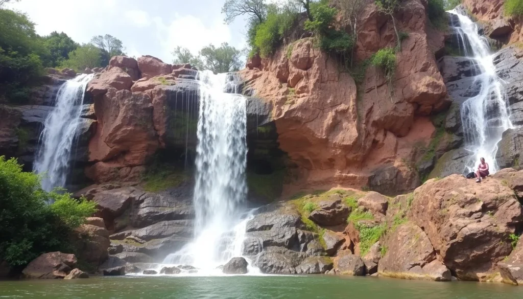 An image of the Matsirga Waterfalls, also known as "River Wonderful," with water cascading down the rocky terrain.