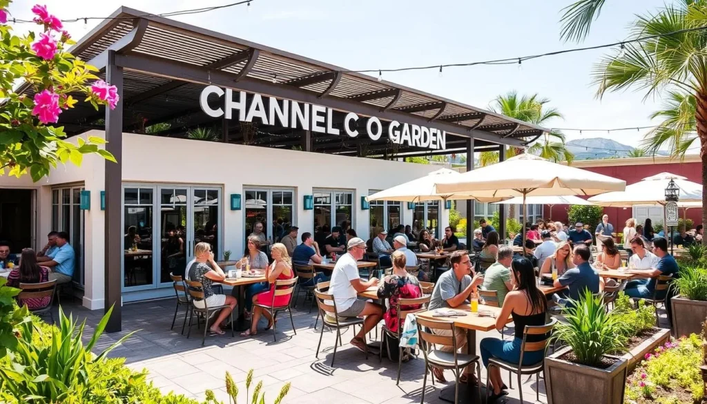 Generate an image of Channel O Garden's beautifully landscaped outdoor seating area with people enjoying drinks.