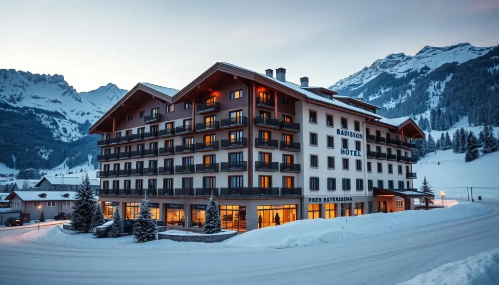 Generate an image of Radisson Blu Hotel Reussen's exterior with a snowy mountain backdrop.