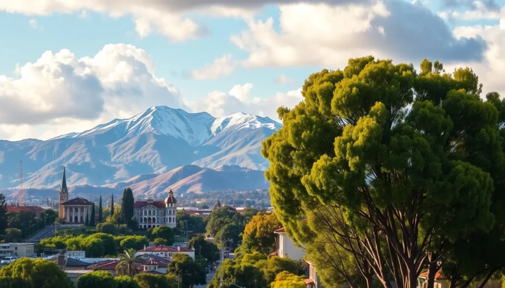 A lush, verdant landscape featuring the majestic San Gabriel Mountains rising majestically in the background, their snow-capped peaks bathed in warm, golden sunlight. In the foreground, the charming cityscape of Pasadena, its iconic architecture and tree-lined streets creating a picturesque scene. A vibrant, colorful sky with fluffy white clouds complements the serene setting, while a sharp, high-resolution lens captures the scene in stunning detail. The overall mood is one of tranquility and natural beauty, showcasing the unique character of this beloved California city.