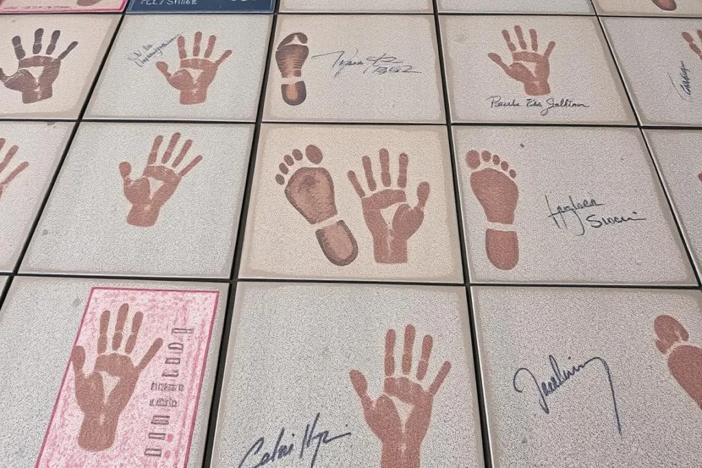 Close-up of celebrity handprints and footprints in the concrete forecourt of TCL Chinese Theatre Close-up of celebrity handprints and footprints in the concrete forecourt of TCL Chinese Theatre
