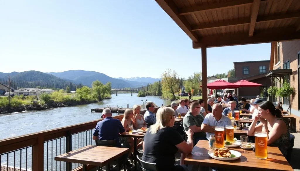 Riverside dining at Old Schoolhouse Brewery in Winthrop with craft beers, food, and mountain views on a sunny day