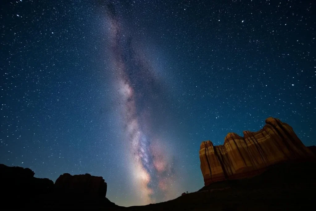 Stargazing at Dinosaur National Monument with Milky Way visible above rock formations Stargazing at Dinosaur National Monument with Milky Way visible above rock formations