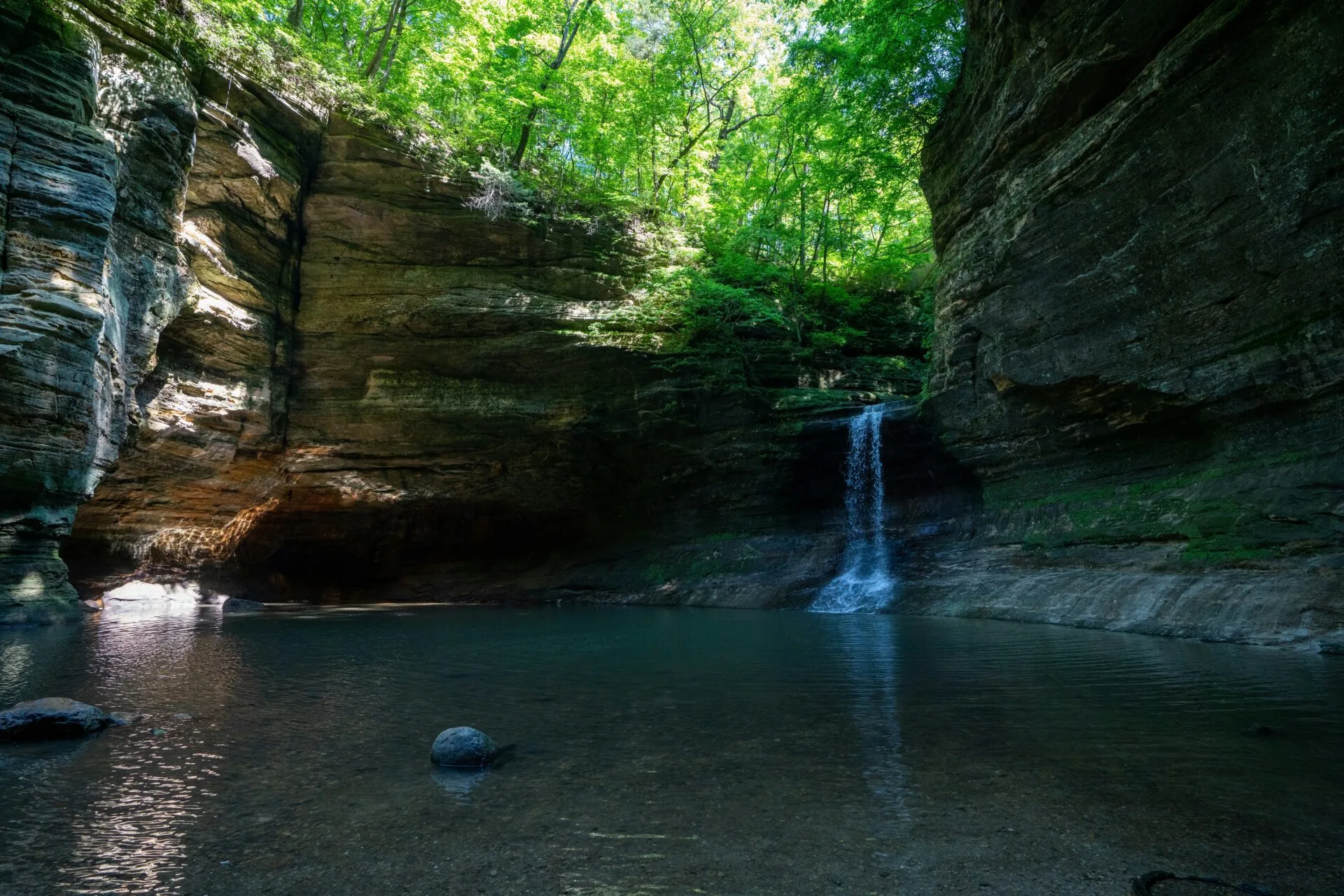 brown rock formation on river
