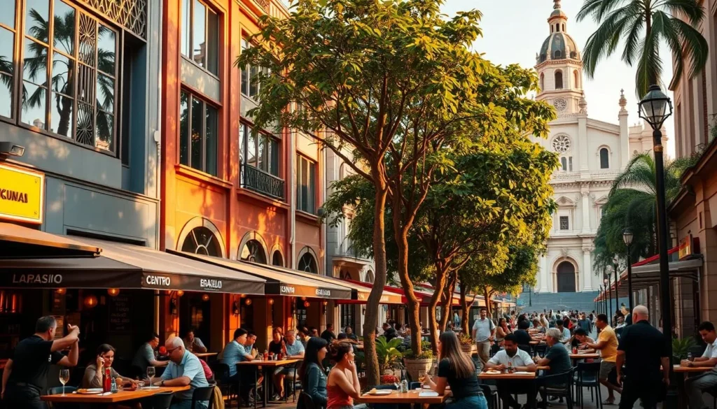 A bustling street in Brasilia's vibrant Centro district, lined with an array of eclectic restaurants and cafes. In the foreground, an outdoor seating area with people enjoying local delicacies and artisanal beverages. The middle ground features the facades of colorful, modern buildings, with large windows and intricate architectural details. In the background, lush tropical foliage and the iconic Brasilia cathedral, bathed in warm, golden light from the afternoon sun. The atmosphere is lively and inviting, capturing the essence of Brasilia's thriving culinary scene.