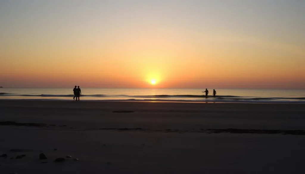 Fall sunset at The Point Island, North Carolina with people walking along the beach
