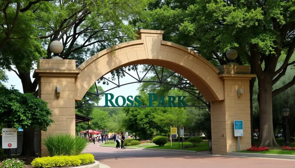 Generate an image of Ross Park Zoo's main entrance, featuring a large stone archway and a sign with the zoo's name. Generate an image of Ross Park Zoo's main entrance, featuring a large stone archway and a sign with the zoo's name.
