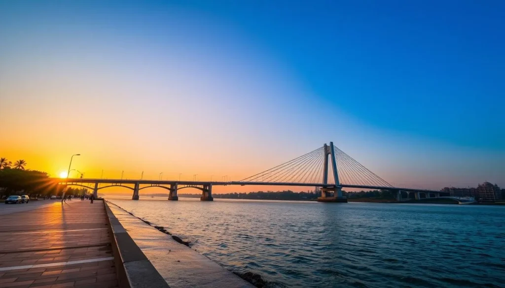 Generate an image of the Howrah riverside promenade with the iconic Howrah Bridge in the background.