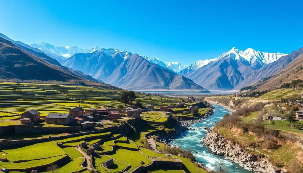 Panoramic view of Hunza Valley with terraced fields, traditional villages, and snow-capped peaks in the background