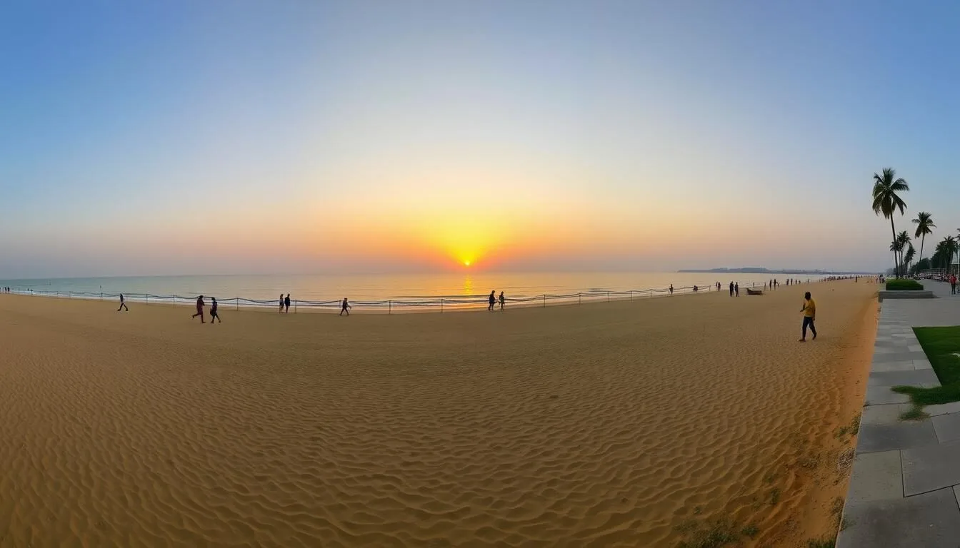 Panoramic view of Marina Beach in Chennai, Tamil Nadu with people walking along the shoreline at sunset
