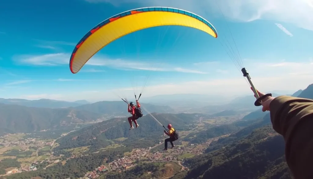 Paragliding over Dhulikhel valley with views of terraced fields and Himalayan mountains