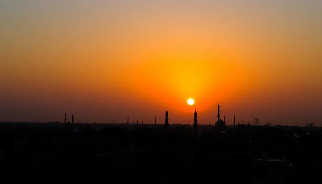 Sunset view of Gujranwala city skyline with minarets and buildings