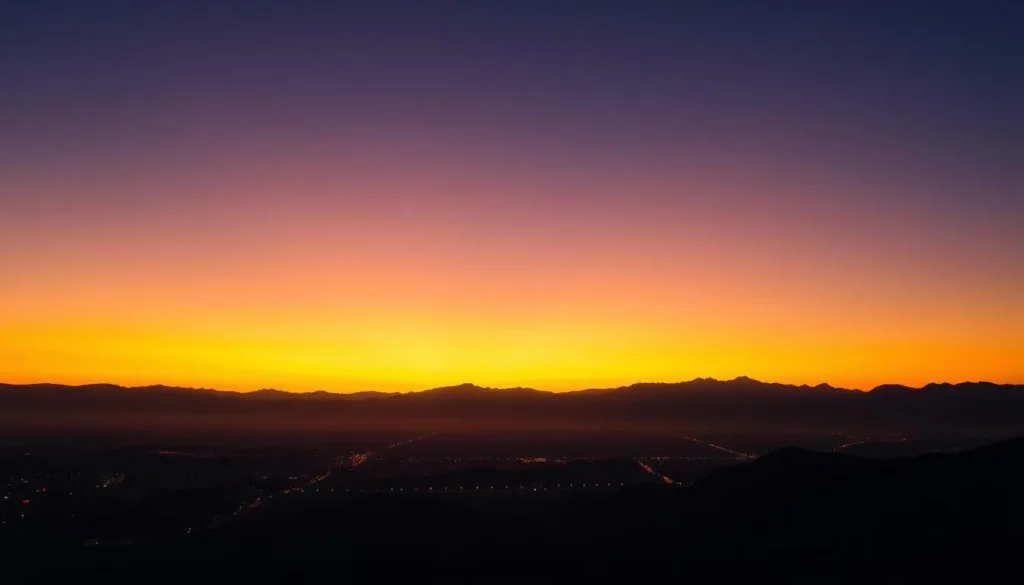 Sunset view over Quetta city with mountains silhouetted against an orange and purple sky