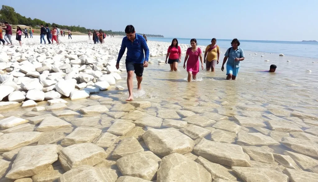 Visitors wading in the shallow waters of Bholaganj Lake among the white stones