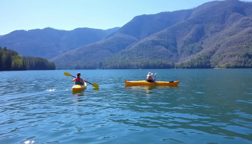 Kayakers paddling on Chilhowee Lake with mountain backdrop