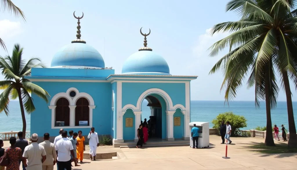 Mohideen Jumma Mosque with blue and turquoise exterior facing the sea
