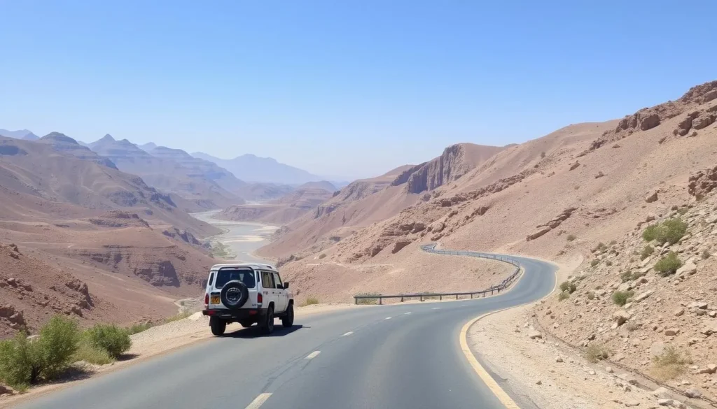 Mountain road leading to Al Awabi with 4WD vehicle navigating the scenic route