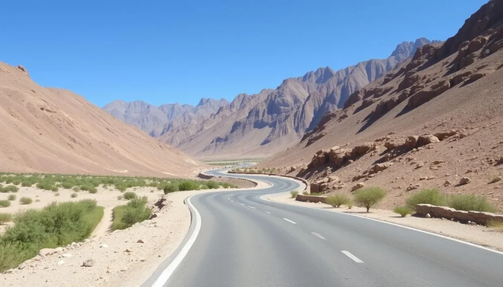 Road leading to Misfah al Abriyyin with mountains in the background