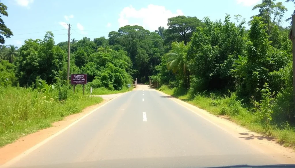 Road leading to Wasgamuwa National Park entrance with signage and surrounding forest