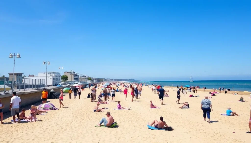 Southsea Beach in Portsmouth on a sunny summer day with people enjoying the seaside