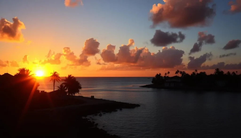 Sunset over Bodden Town coastline with palm trees and historic buildings