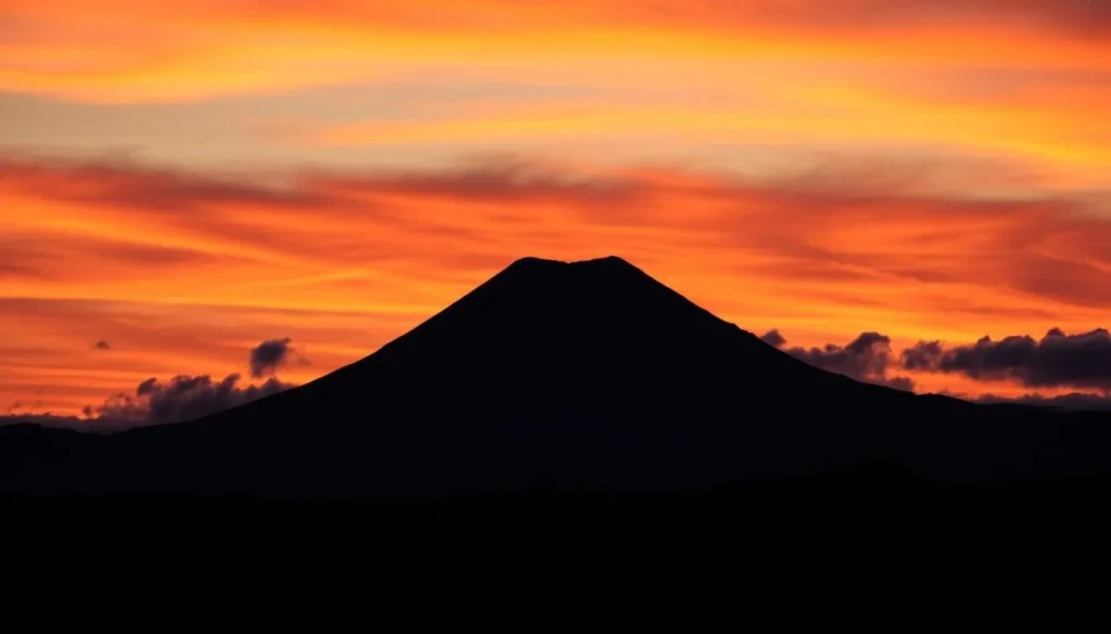 Sunset over Cotopaxi National Park with the volcano silhouetted against a colorful sky