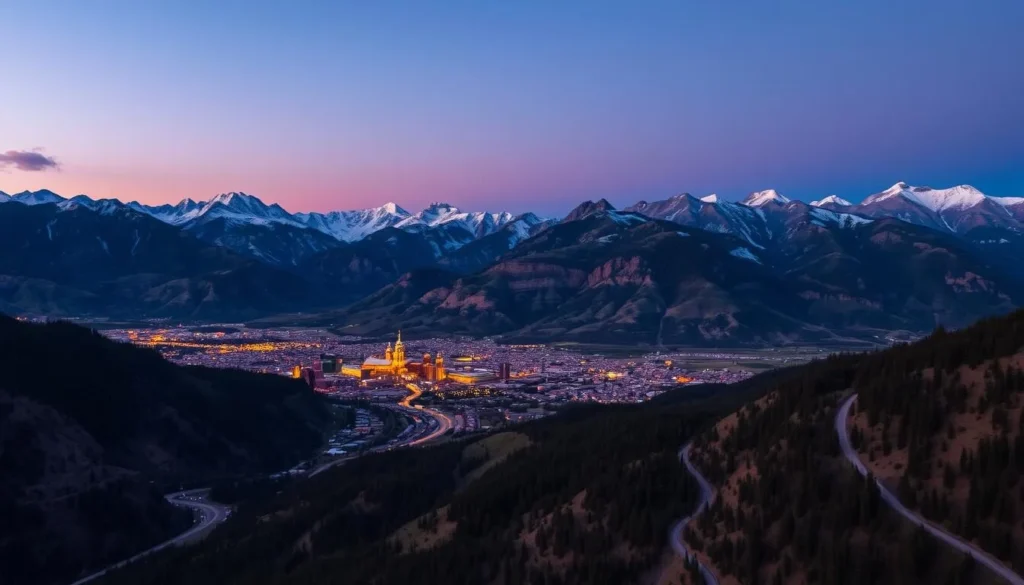 Sunset over Telluride Colorado showing the town lights coming on with alpenglow on surrounding peaks Sunset over Telluride Colorado showing the town lights coming on with alpenglow on surrounding peaks