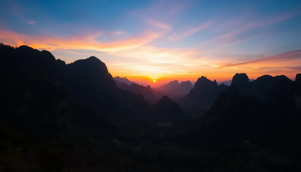 Sunset over limestone karst landscape in Phou Hin Poun National Protected Area
