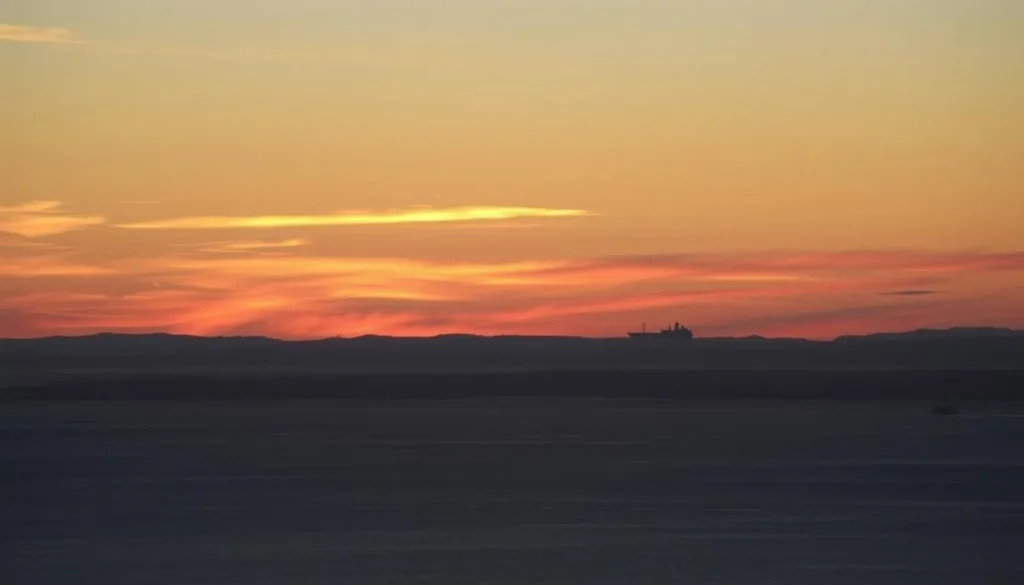 Sunset over the Strait of Magellan viewed from Punta Arenas, showcasing the beauty of this destination