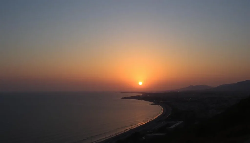 Sunset view over Latakia's Mediterranean coastline with the city lights beginning to twinkle