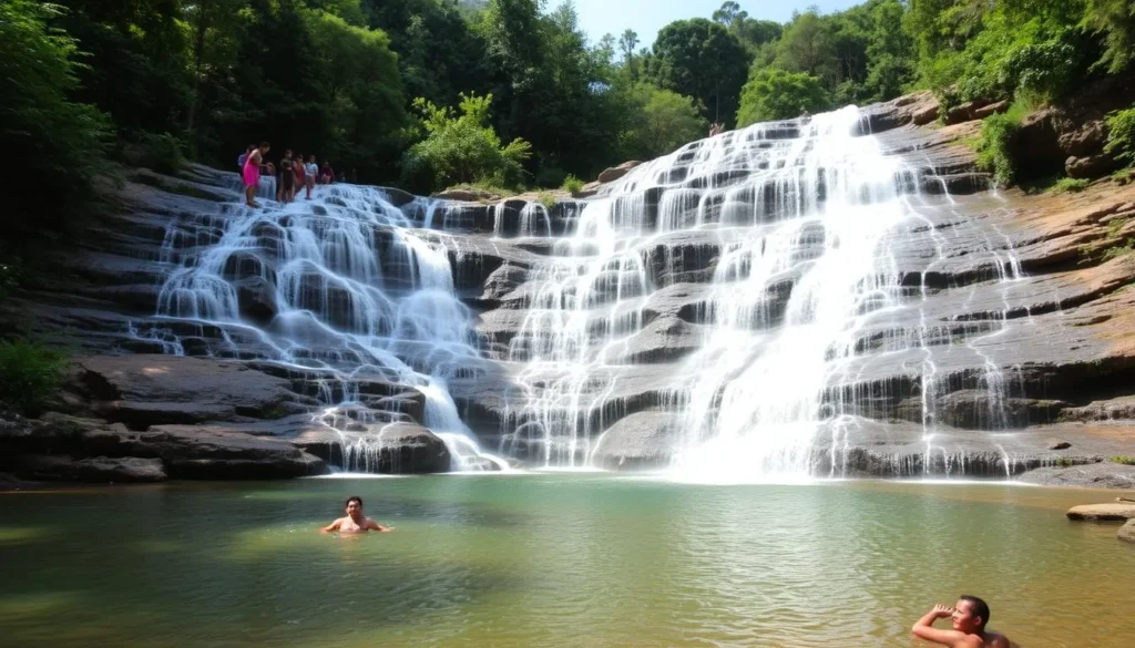 Tad Xay Waterfall in Phou Khao Khouay National Protected Area with people swimming