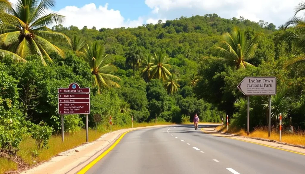 The road approach to Indian Town National Park with clear signage and surrounding tropical vegetation