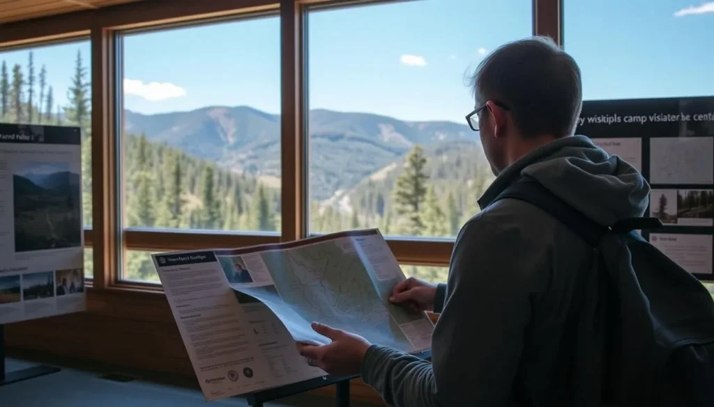 Visitor checking a trail map at the Barnes Camp Visitor Center in Smugglers Notch State Park