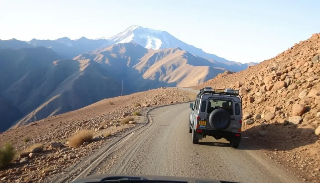 A 4WD vehicle driving on a mountain road with Mount Abuna Yosef in the background