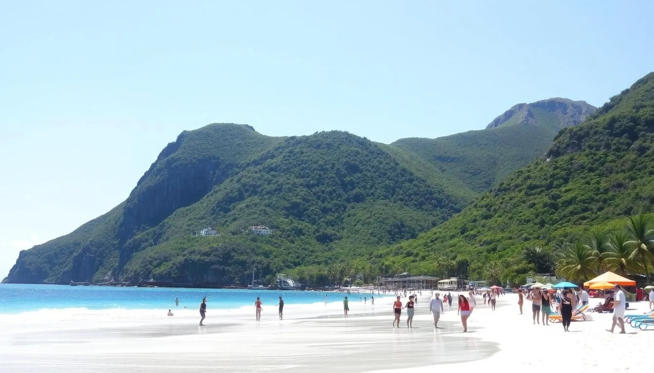 Aerial view of St. Jean Beach showing its pristine white sand and turquoise waters with St. Barts' lush green hills in the background