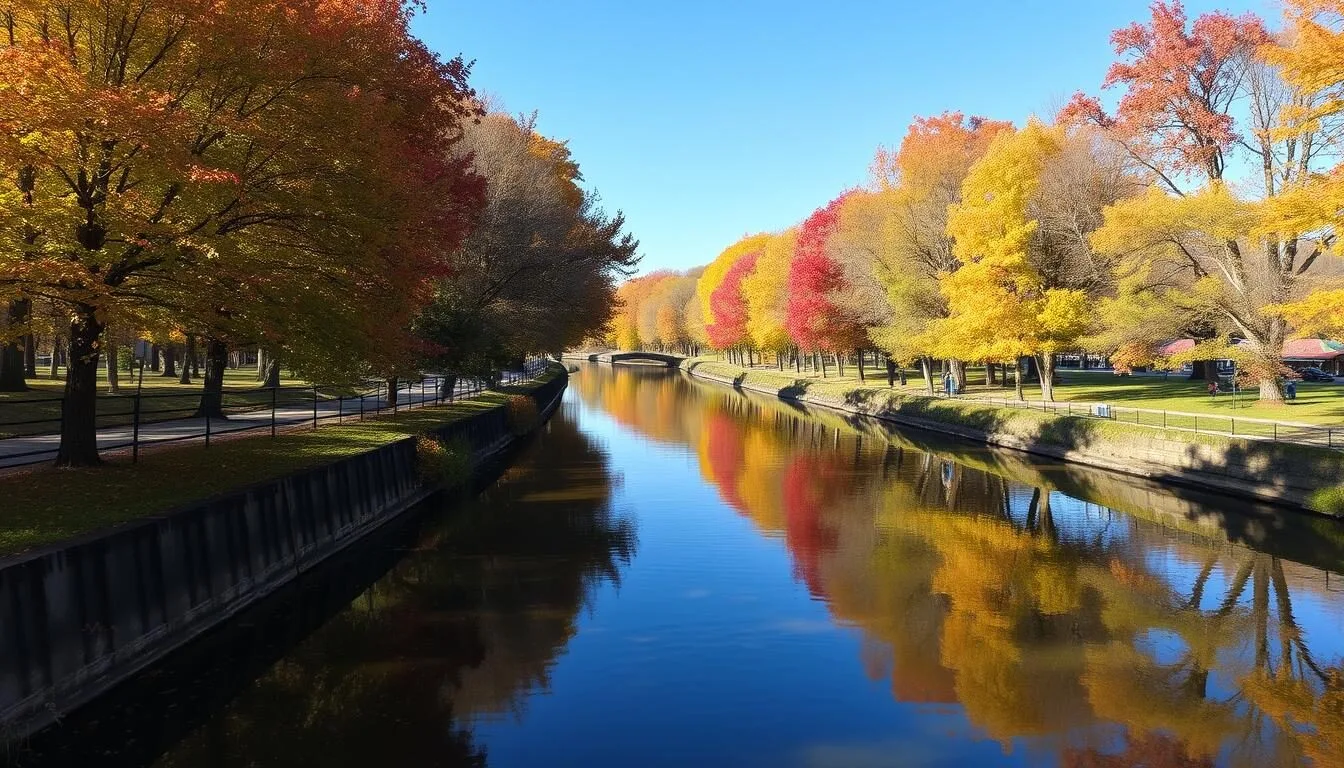 Scenic-view-of-the-Hennepin-Canal-State-Park-showing-the-waterway-with-trees-lining-both-sides- Scenic view of the Hennepin Canal State Park showing the waterway with trees lining both sides during autumn with colorful foliage