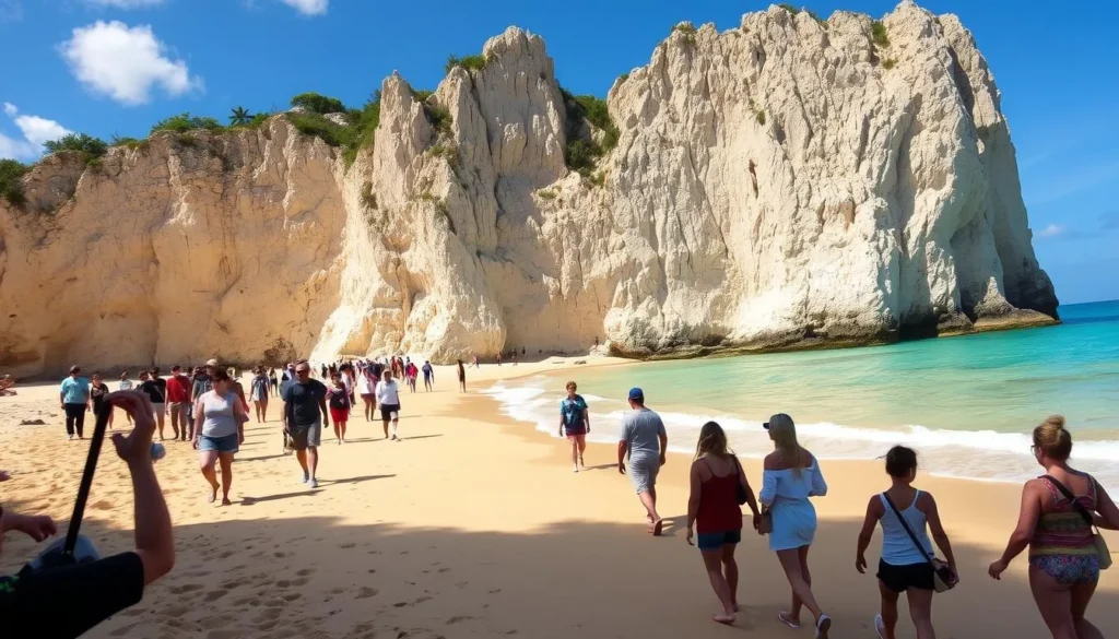 Tourists exploring the limestone cliffs at Cupecoy Beach Tourists exploring the limestone cliffs at Cupecoy Beach