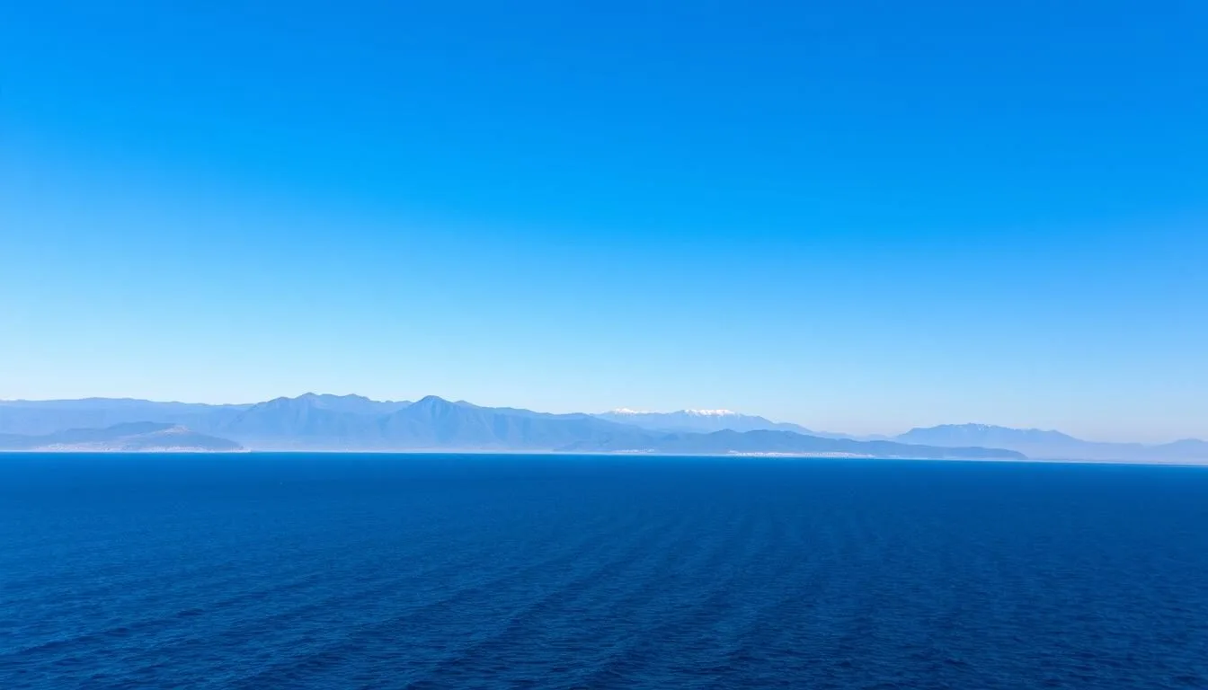 Scenic coastal view of Sakhalin Oblast with mountains in the background on a clear day