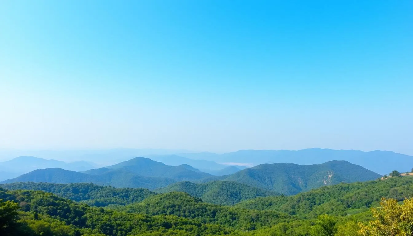 Scenic landscape of Chhattisgarh showing lush green forests and mountains under blue sky