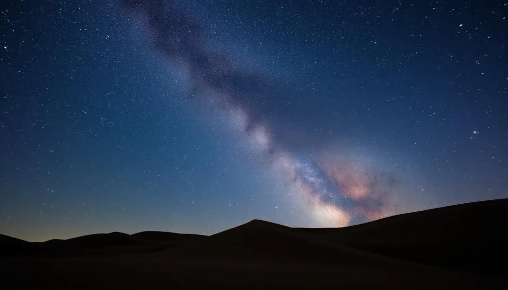 Starry night sky over the sand dunes showing the Milky Way galaxy