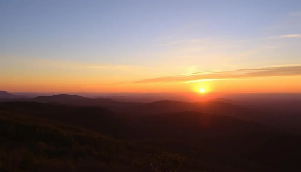 Sunset view from High Knob Overlook near Worlds End State Park showing mountains bathed in golden light
