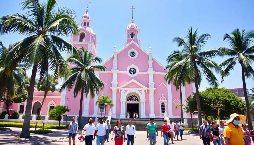 The pink-colored Our Lady of Angels Church in Puducherry with palm trees