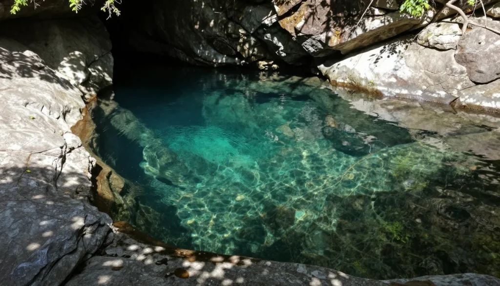 Natural swimming hole with clear water and rock formations