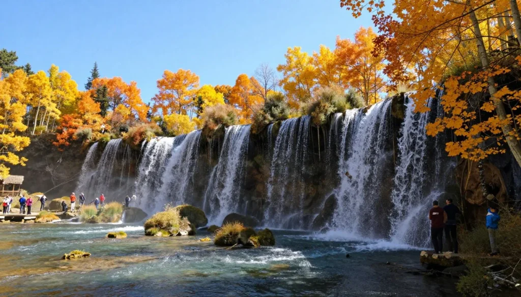 Rifle Falls State Park in autumn with colorful foliage and flowing waterfalls Rifle Falls State Park in autumn with colorful foliage and flowing waterfalls
