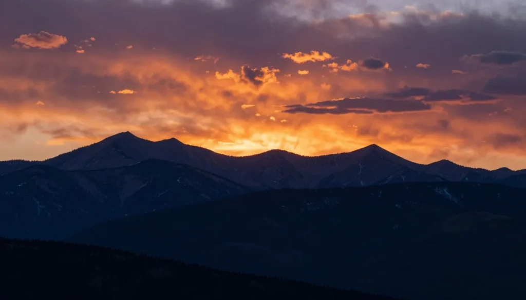Sunset over Never Summer Mountains with silhouetted peaks